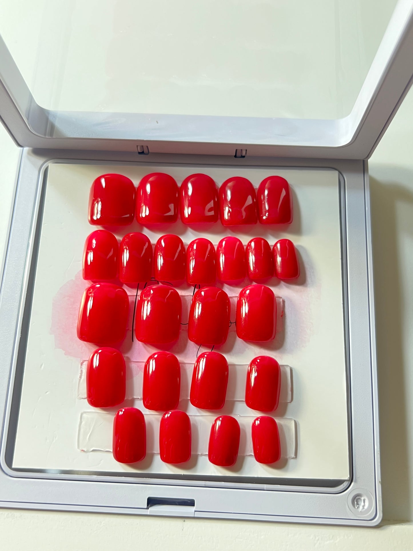Set of 24 short square dark pink nails. In a container to keep your nails safe.