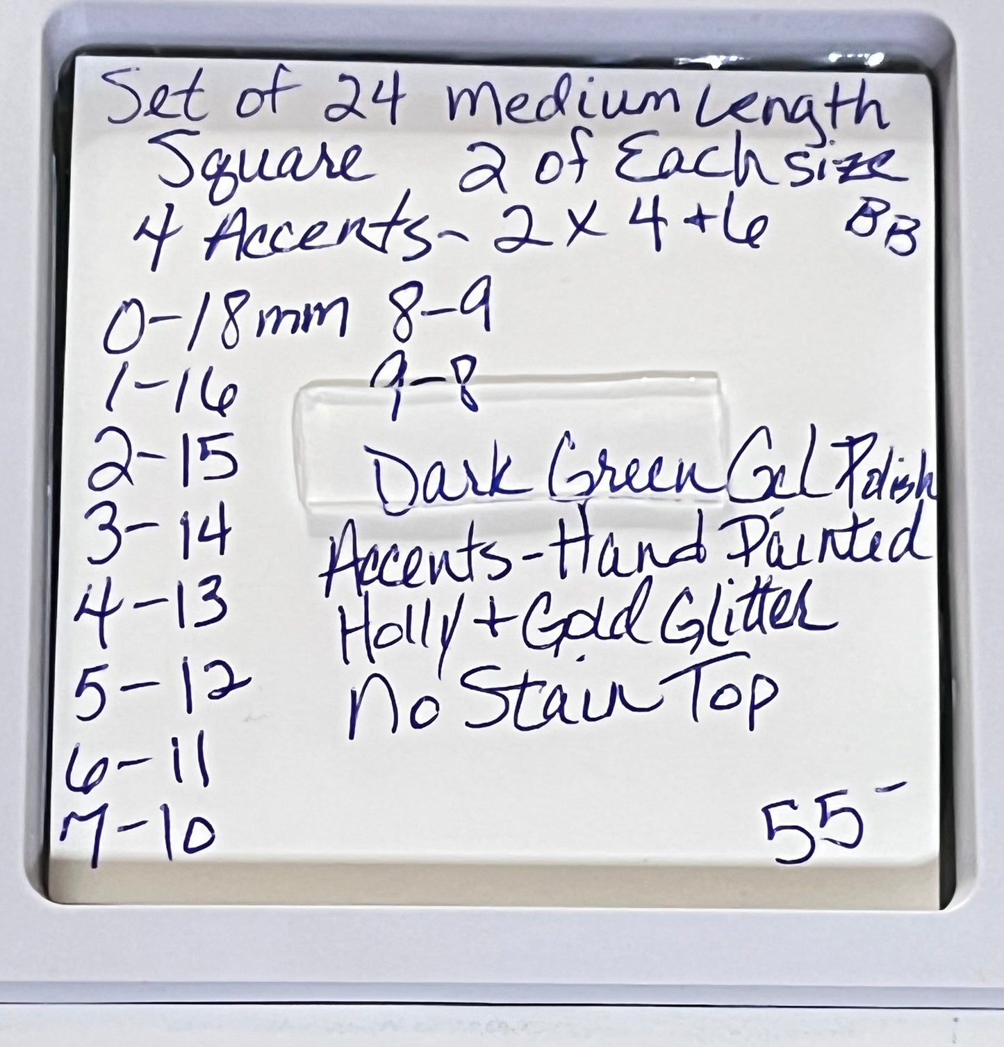Set of 24 medium length square nails and 4 accent nails with hand painted holy with a sprinle of gold glitter. The other 20 nails are a solid dark green gel polish and not stain top coat.