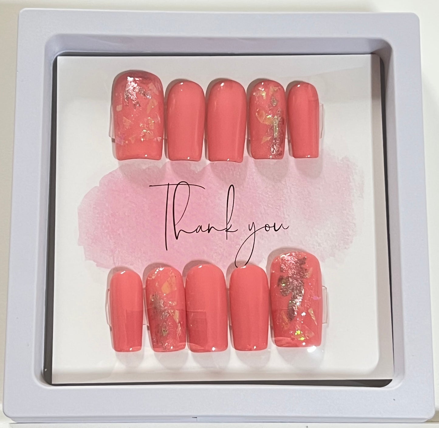 Size Large set of 10 medium length square nails. Included are 4 accent nails with the same medium shade of pink gel polish, with foil and a little glitter. No stain top coat.