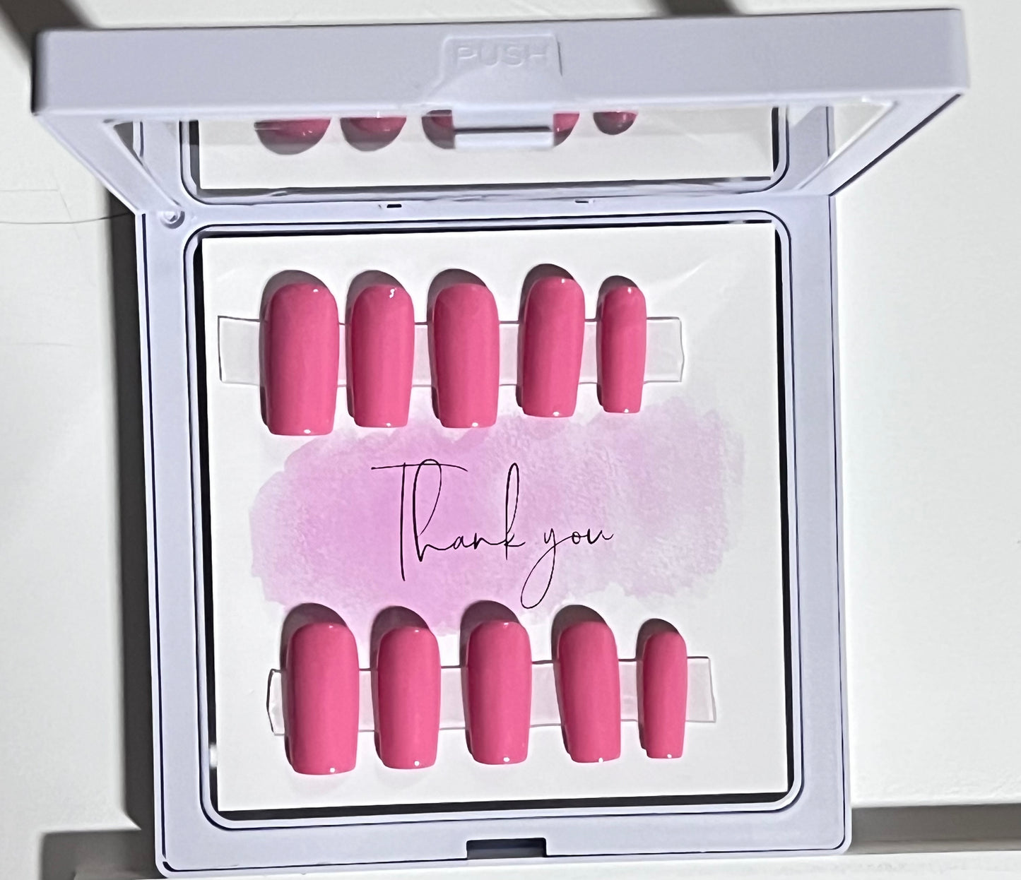 Set of 10 size small with a soft pink gel polish and no stain top coat. Medium length square.