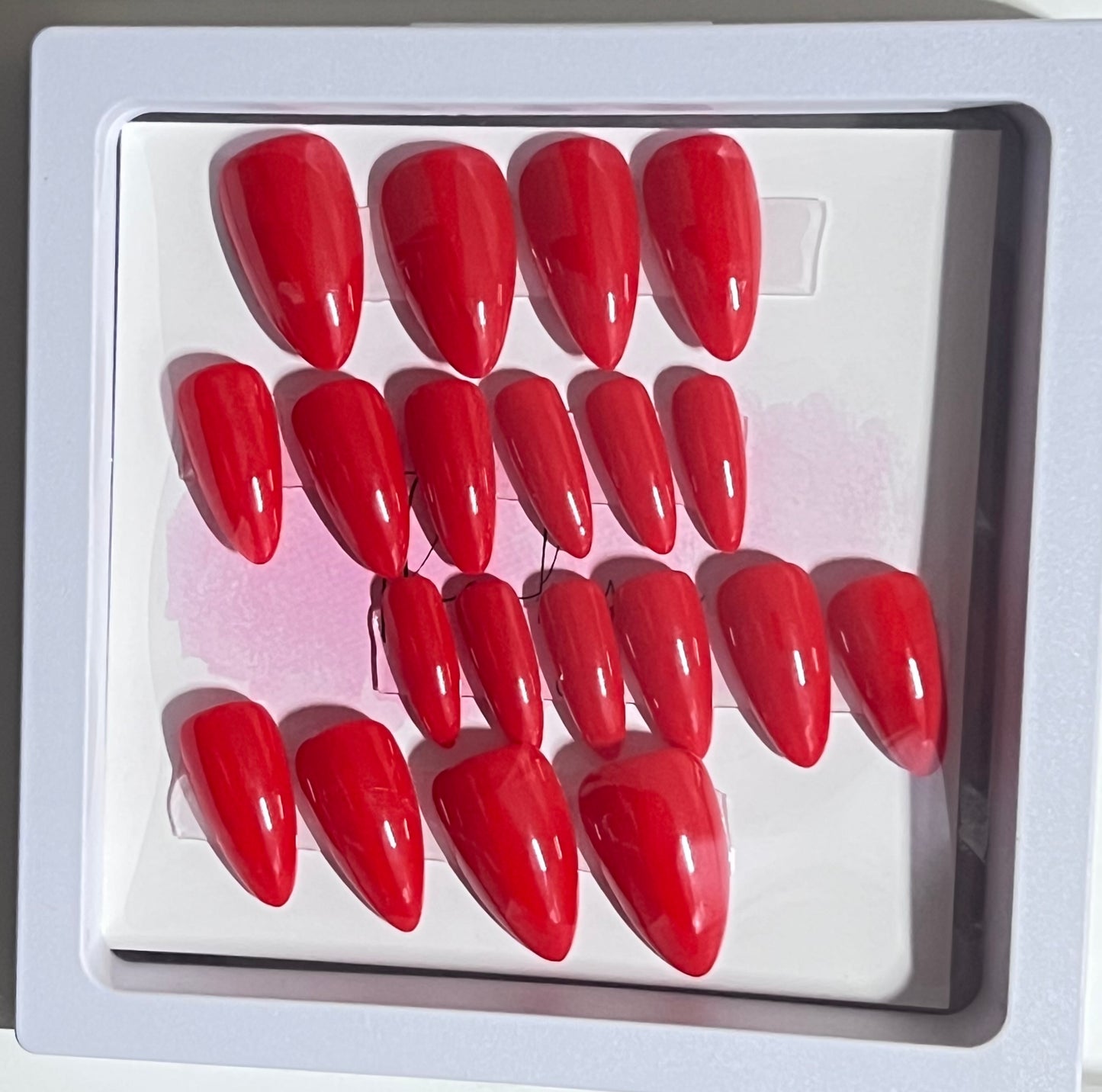 Set of 20 short stiletto nails with a gorgeous red gel polish and no stain top coat.