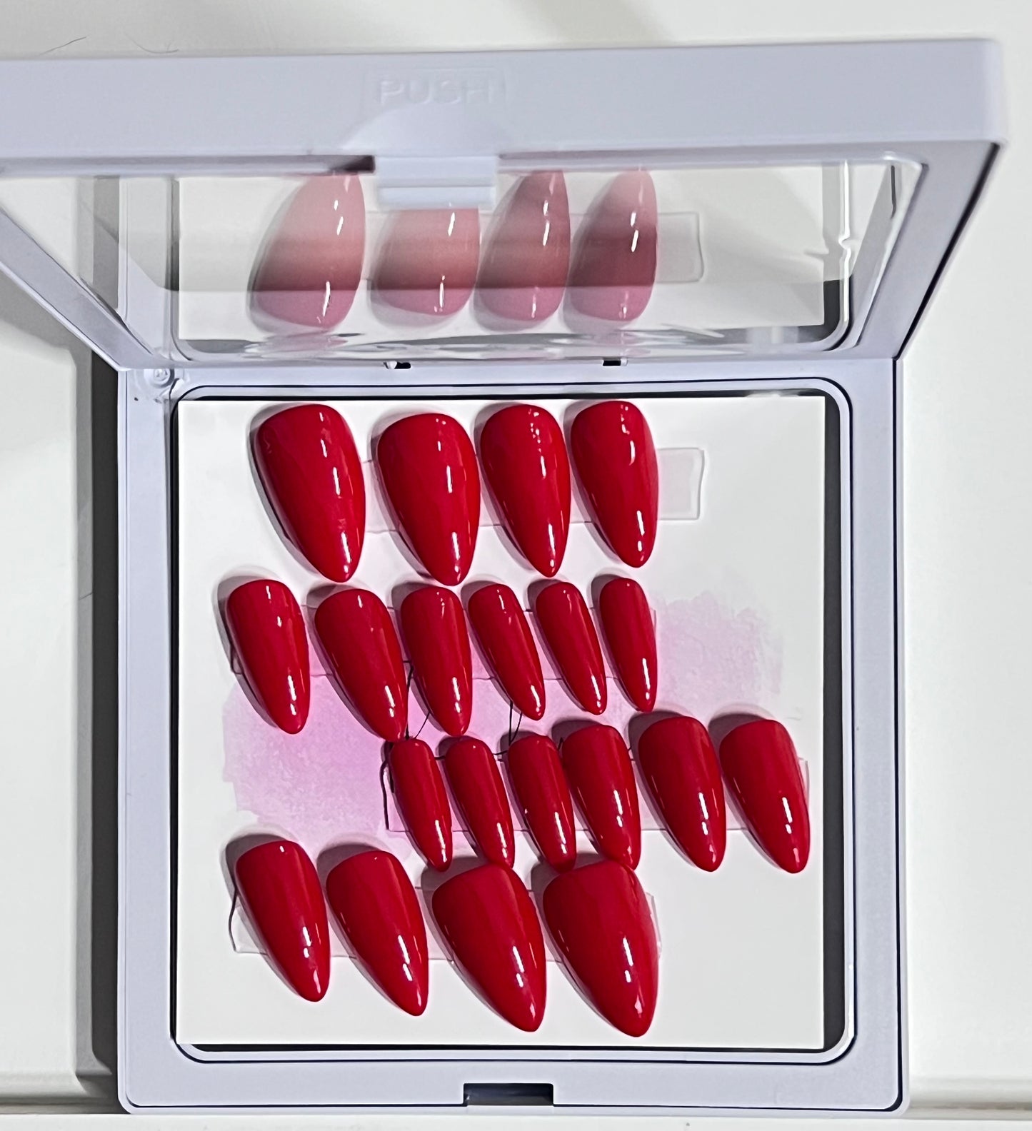 Set of 20 short stiletto nails with a gorgeous red gel polish and no stain top coat.