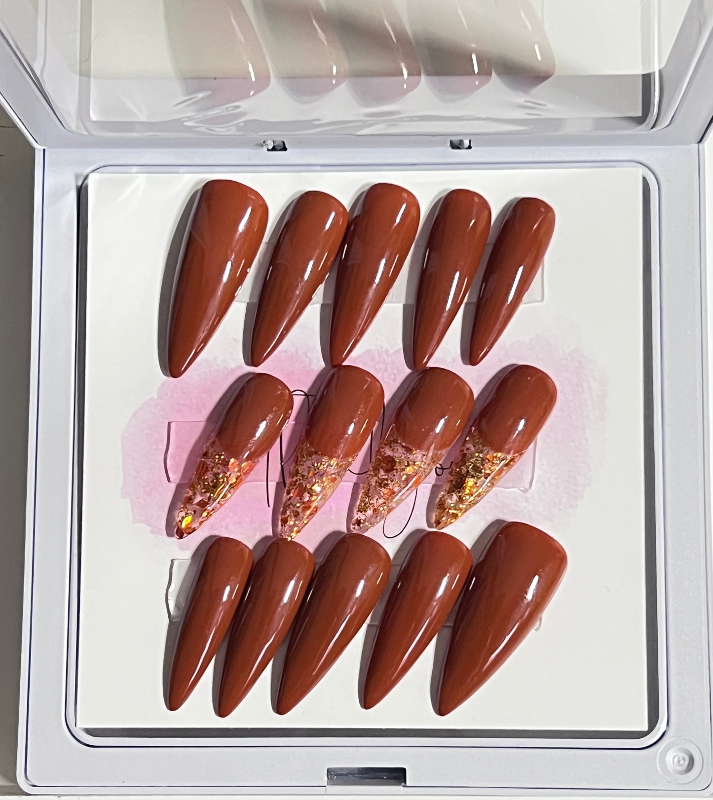 Set of 24 size large medium length stiletto nail. Included are 4 accent nails with the same brown gel polish and gold & copper fleck as the French.
