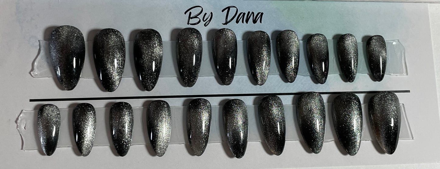 Hand painted black gel polish with silver chrome over all 20 nails.