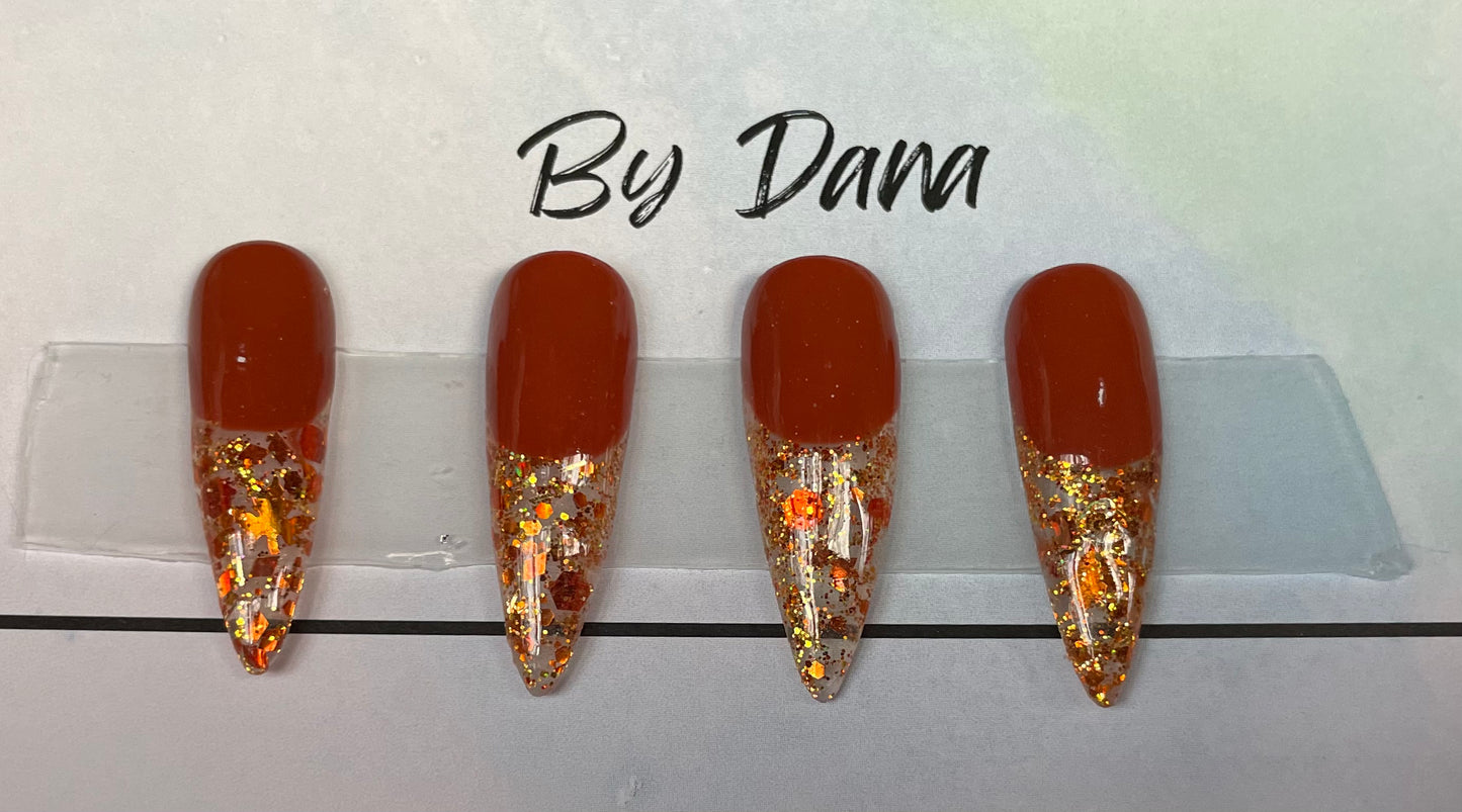 Hand painted and designed. 4 accent nails with different colored glitter and flec on tip.