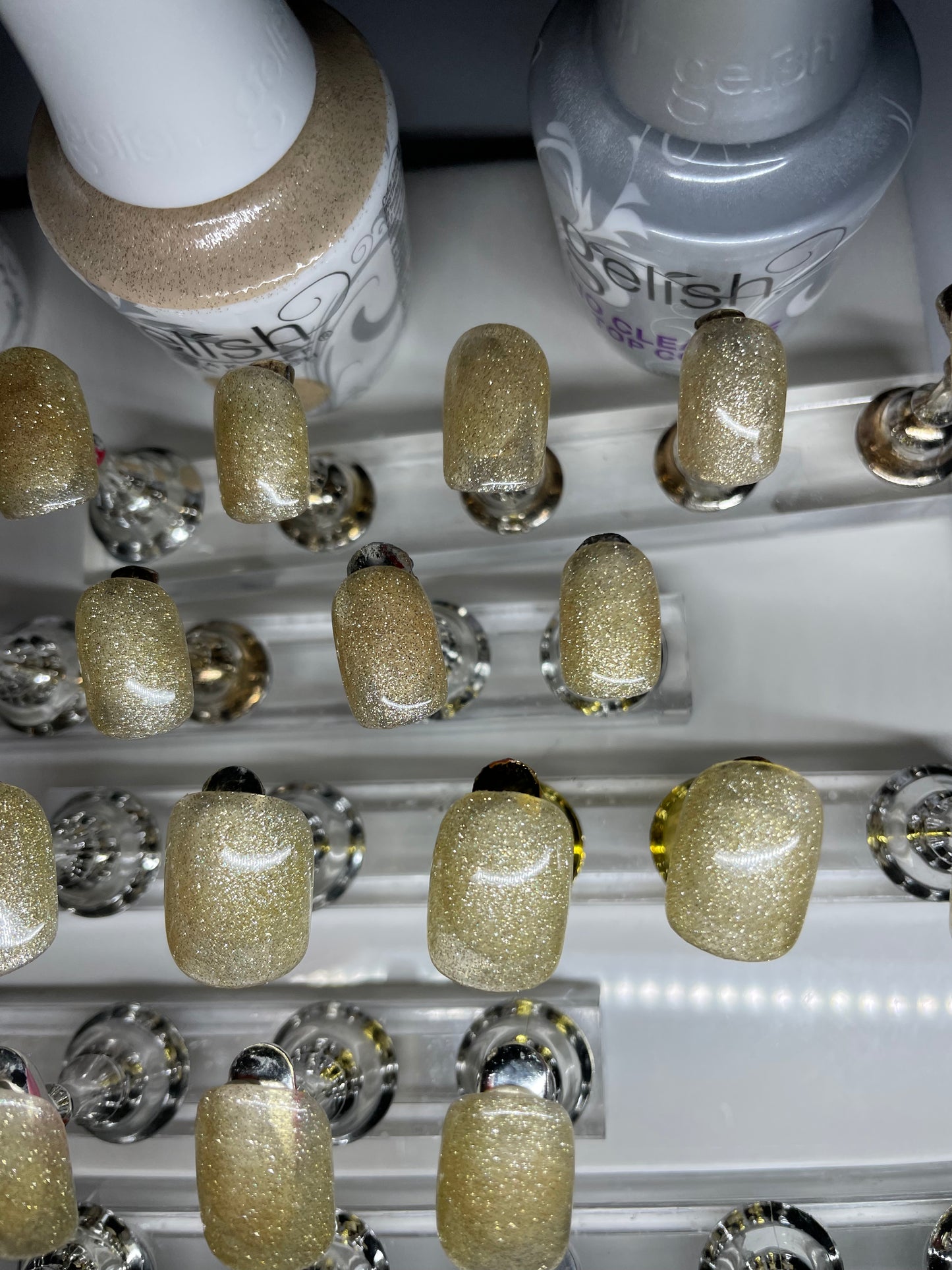 Sizes 0-11 with 2 of each size. Hand painted with gold glittery gel polish.