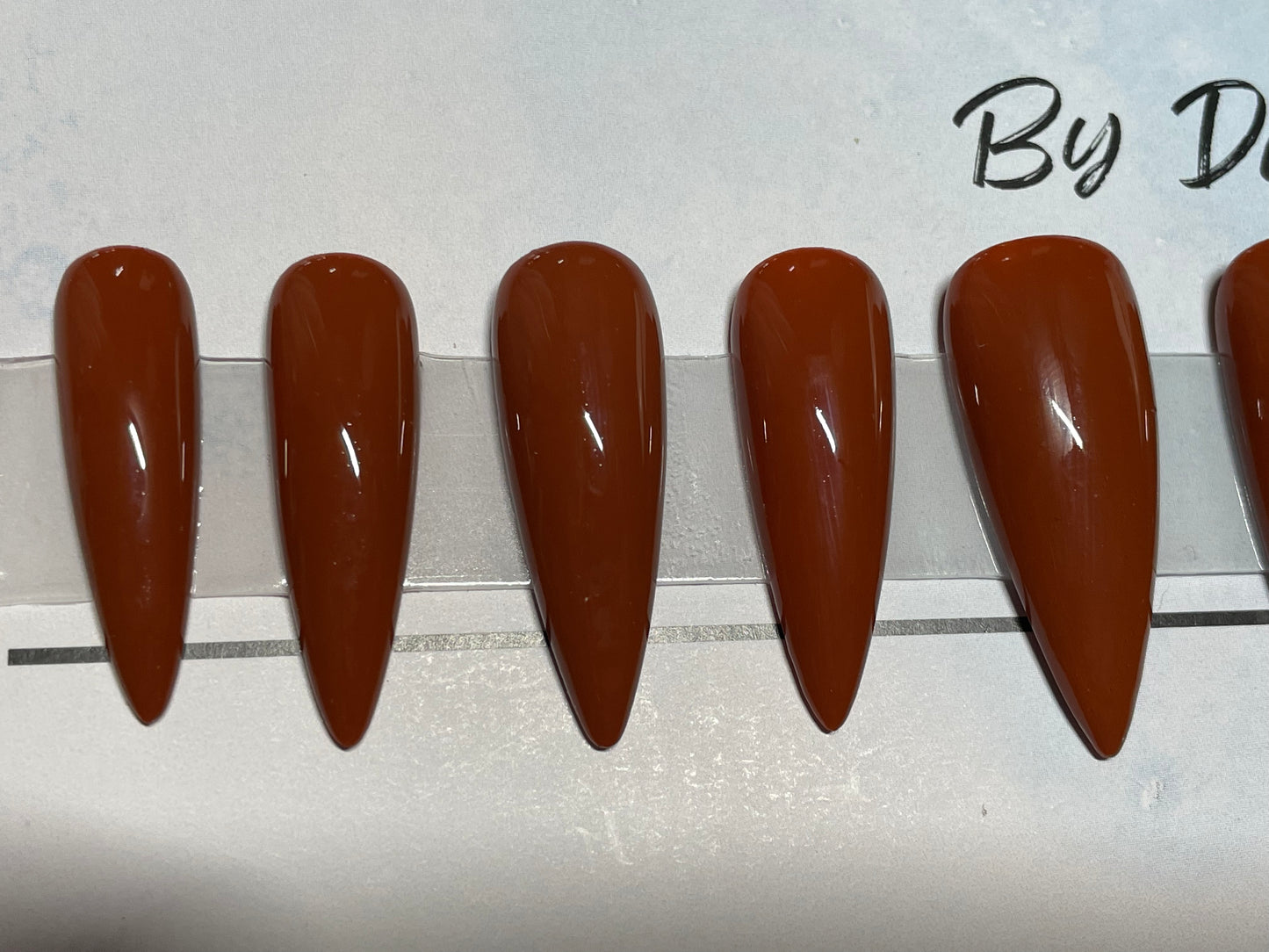 A great hand painted color for fall or spring. Long Stiletto in a size Large.
