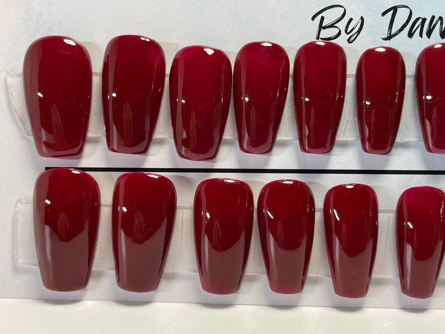 Professionally hand painted Deep red nails.