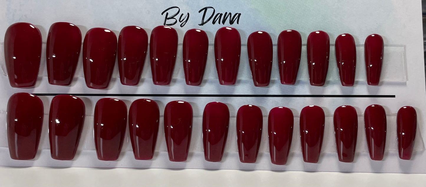 Professionally hand painted Set of 24 nails in a gorgeous dark red gel polish.