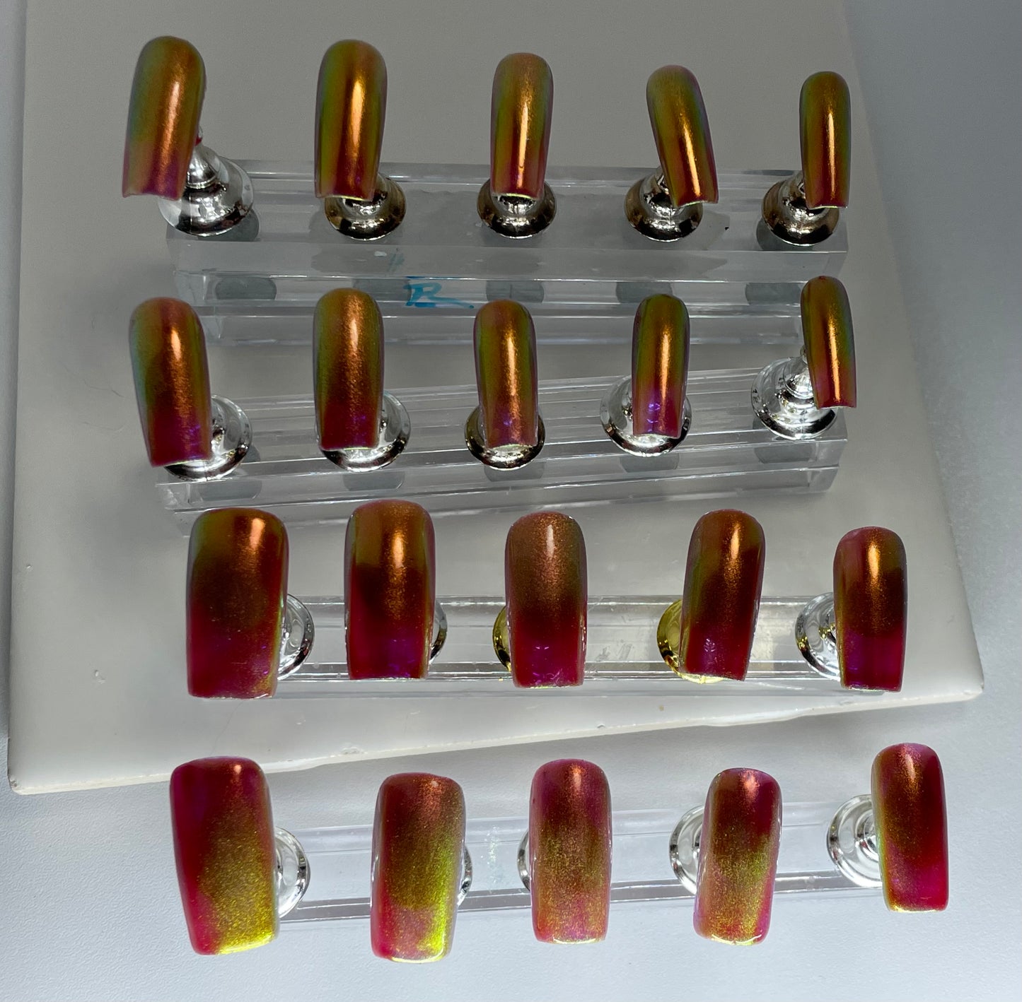 Medium length square nails. Great colors in different lighting.