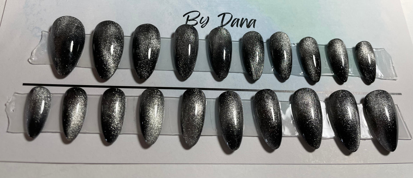 Set of 20 hand painted nails with black gel polish and a chrome effect on all of them.