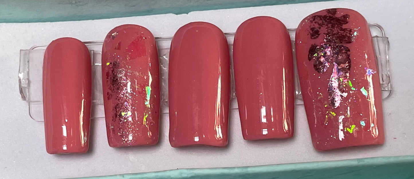 Size Large set of 10 medium length square nails. Included are 4 accent nails with the same medium shade of pink gel polish, with foil and a little glitter. No stain top coat.