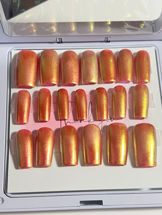 Set of 20 Medium length square press-on nails with a dark red gel polish and aurora chrome over the whole nail. No stain top coat 