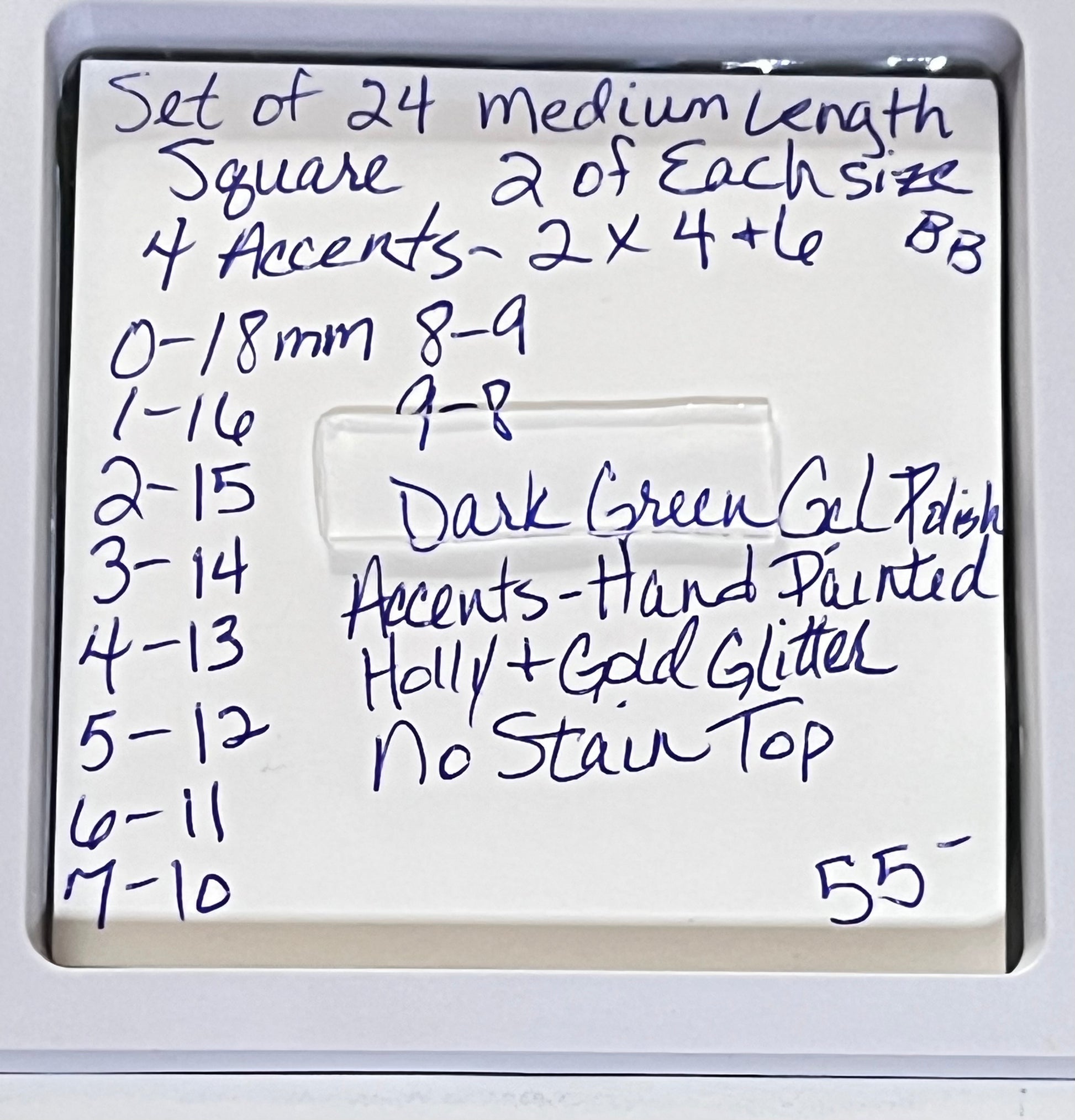 Set of 24 medium length square nails and 4 accent nails with hand painted holy with a sprinle of gold glitter. The other 20 nails are a solid dark green gel polish and not stain top coat.