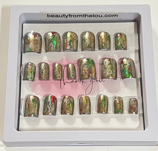 Set of 20 natural extra short square nails with gray gel polish base color and red, green, silver & gold foil over all nails. No stain top coat.