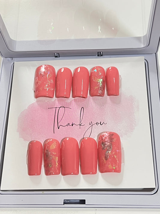 Size Large set of 10 medium length square nails. Included are 4 accent nails with the same medium shade of pink gel polish, with foil and a little glitter. No stain top coat.