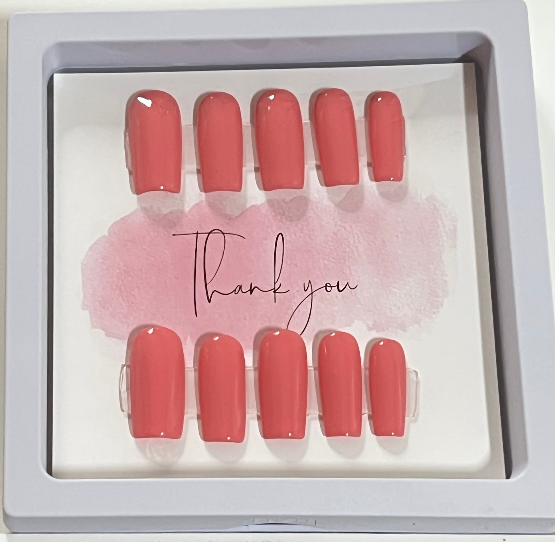 Set of 10 size extra small with medium length square light pink gel polish and no stain top coat. 
