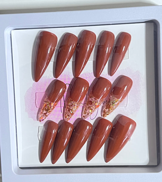 Set of 24 size large medium length stiletto nail. Included are 4 accent nails with the same brown gel polish and gold & copper fleck as the French.