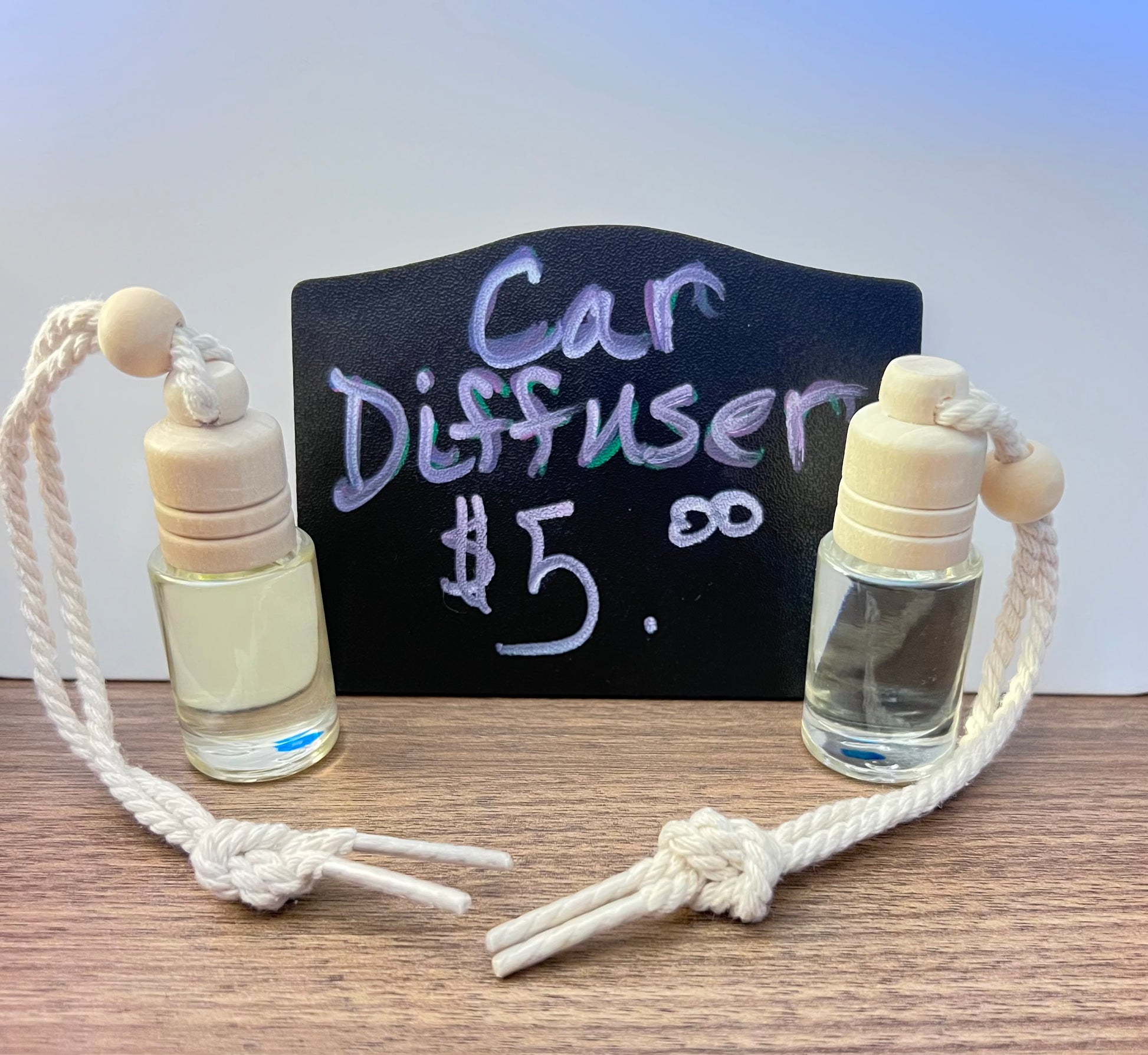 Car diffuser with a price sign on a wooden surface