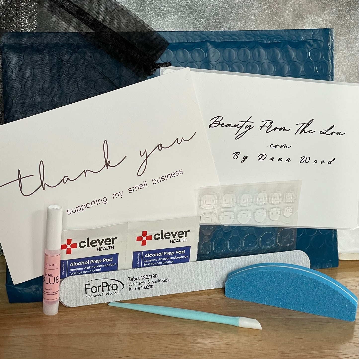 Nail Kit included with every full set purchase. Instructions for application and removal. A professional nail file, a buffer, cuticle pusher, alcohol wipes, tabs and glue.