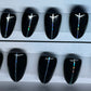 Set of 20 short round nails professionally painted by a Nail Tech. Black gel polish and pin stripping down the center.. 
