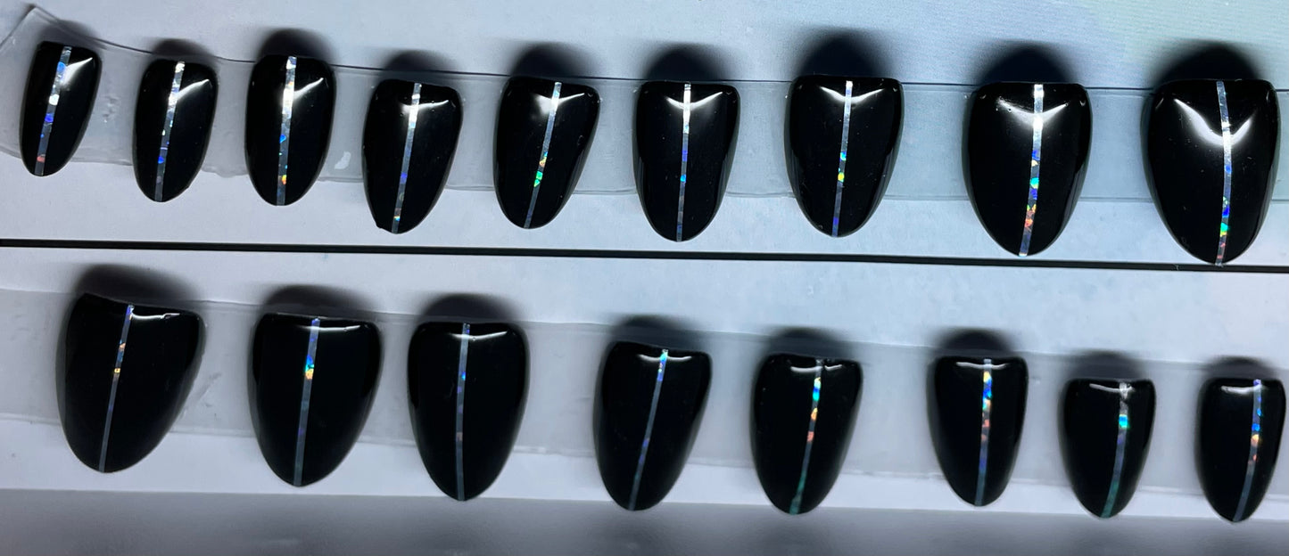 Set of 20 short round nails professionally painted by a Nail Tech. Black gel polish and pin stripping down the center.. 