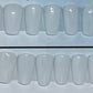 Milky white hand painted nails that go with everything in your wardrobe. 