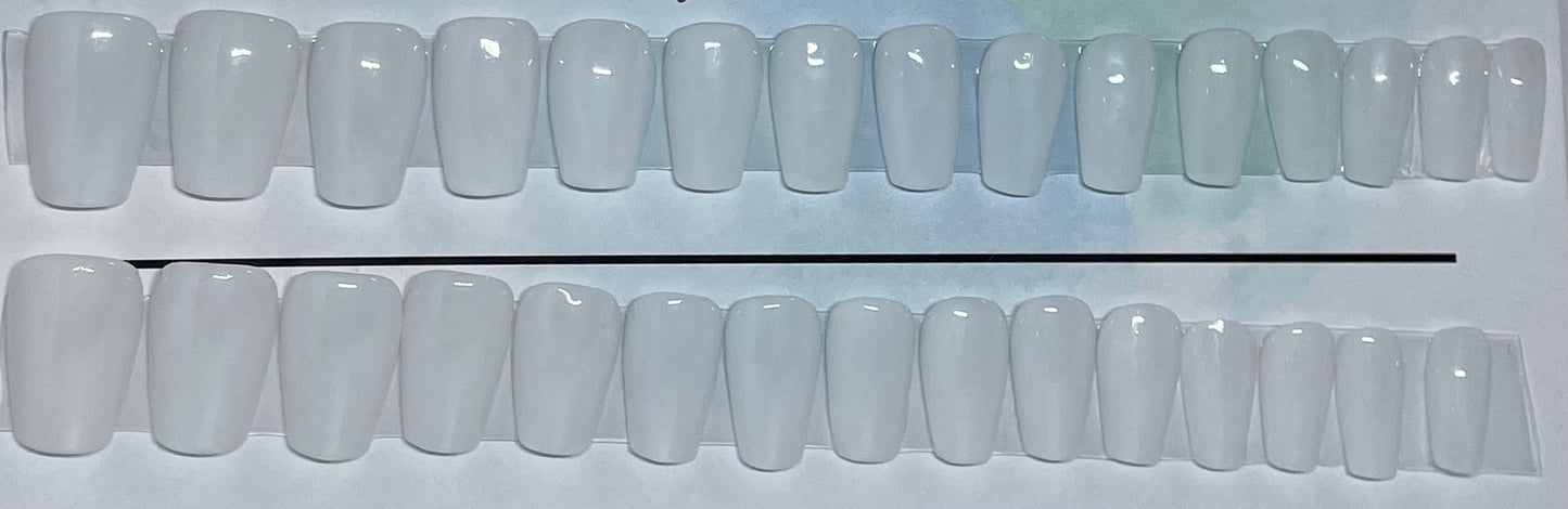 Milky white hand painted nails that go with everything in your wardrobe. 