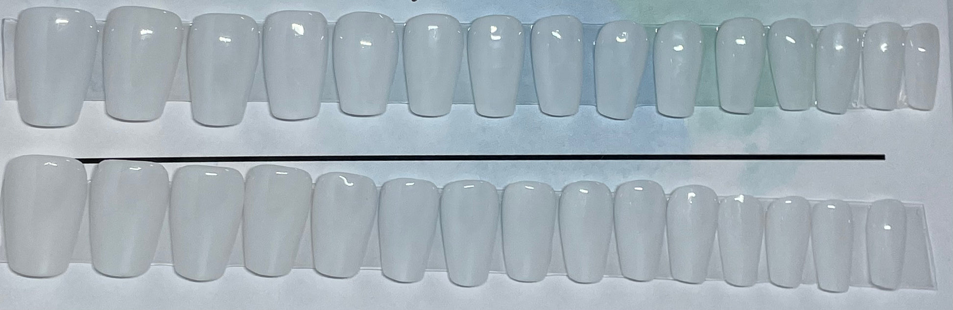 Milky white hand painted nails that go with everything in your wardrobe. 