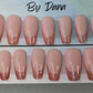 Set of 24 hand painted pink french nails. 4 are pierced with silver jump rings in them. 