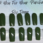 A dark green with accents that have some holly on them with the gold glitter by the cuticle. All professionally hand painted!