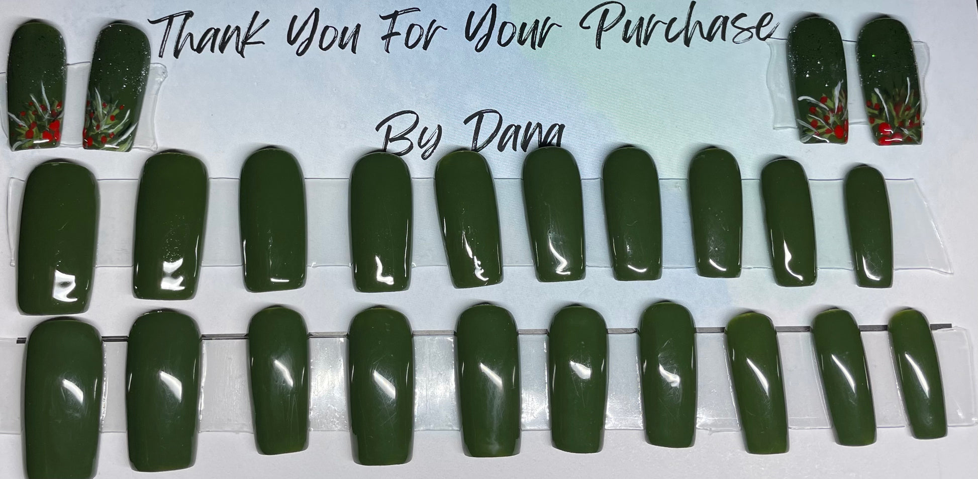 A dark green with accents that have some holly on them with the gold glitter by the cuticle. All professionally hand painted!