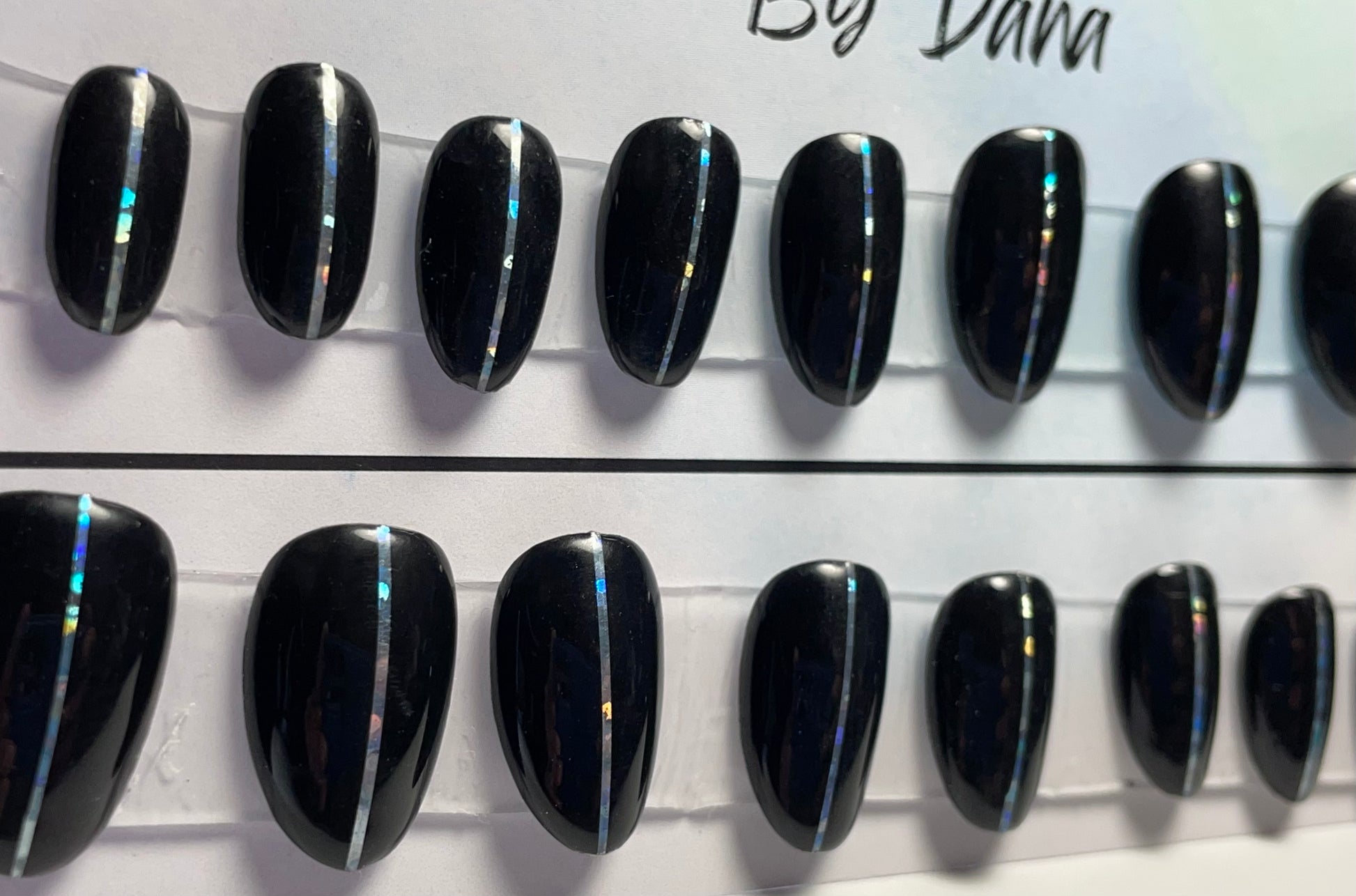 Fun black gel polished nails that will go with every outfit and every occasion. Professionally polished. 
