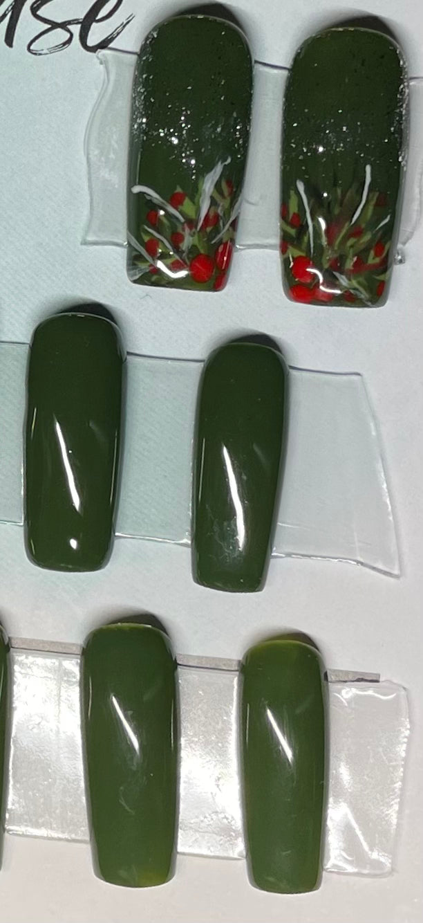 I am not a photographer obviously, but I am a professional nail tech. 4 accent nails with a slight gold glitter around the cuticles. So pretty in person. Dark green gel polish. 