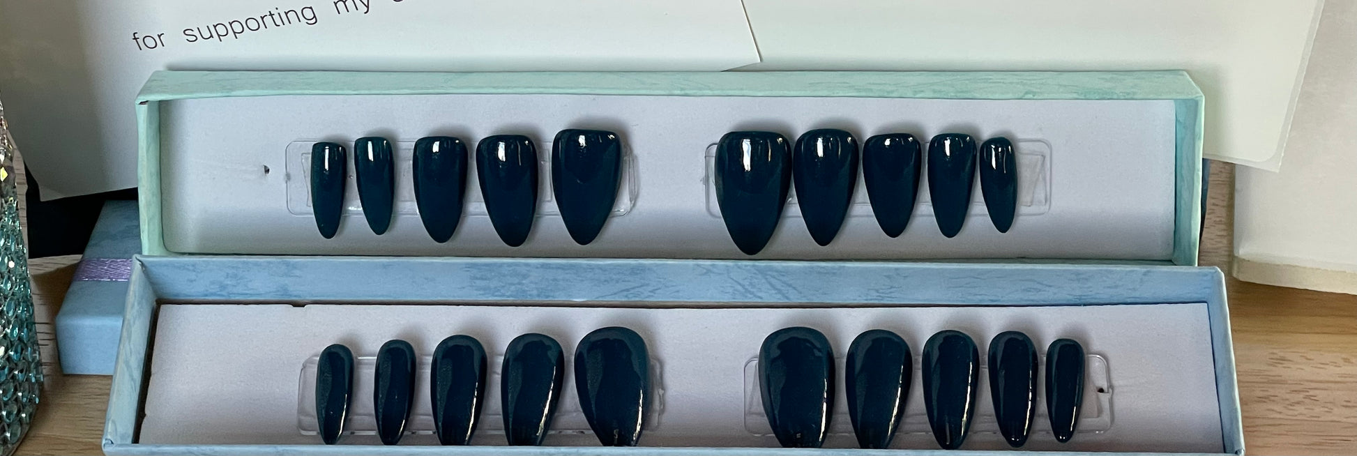 Set of 20 Full Cover reusable professionally hand painted Tips in a Dark Blue Gel Polish. Considered a short stiletto.